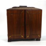 A Regency rosewood and brass inlaid collectors' cabinet, the two doors enclosing four drawers,