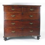 A late 18th/early 19th century mahogany chest of two short over three long graduated drawers on bun