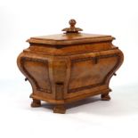 A Regency burr elm wine cooler of sarcophagus form,