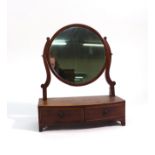 A George III mahogany and crossbanded swing mirror,