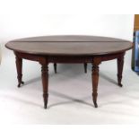 A mid-19th century mahogany circular dining table, consisting of two D-end sections,