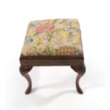 An 18th century walnut and upholstered foot stool on cabriole feet CONDITION REPORT: