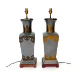 A pair of French pewter table lamps with brass floral mounts, of square tapering form,