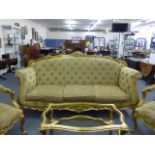 A Louis XV-style florally carved giltwood and upholstered three seater saloon settee