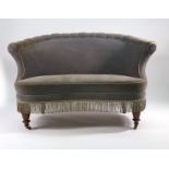 A Victorian fully upholstered parlour sofa of curved form on turned oak feet CONDITION