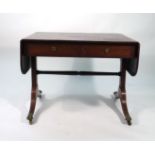 A Regency mahogany and ebony inlaid sofa table with two frieze drawers on sabre legs, l.