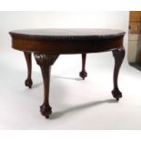 A Chippendale-type mahogany extending dining table, with one fitted leaf,