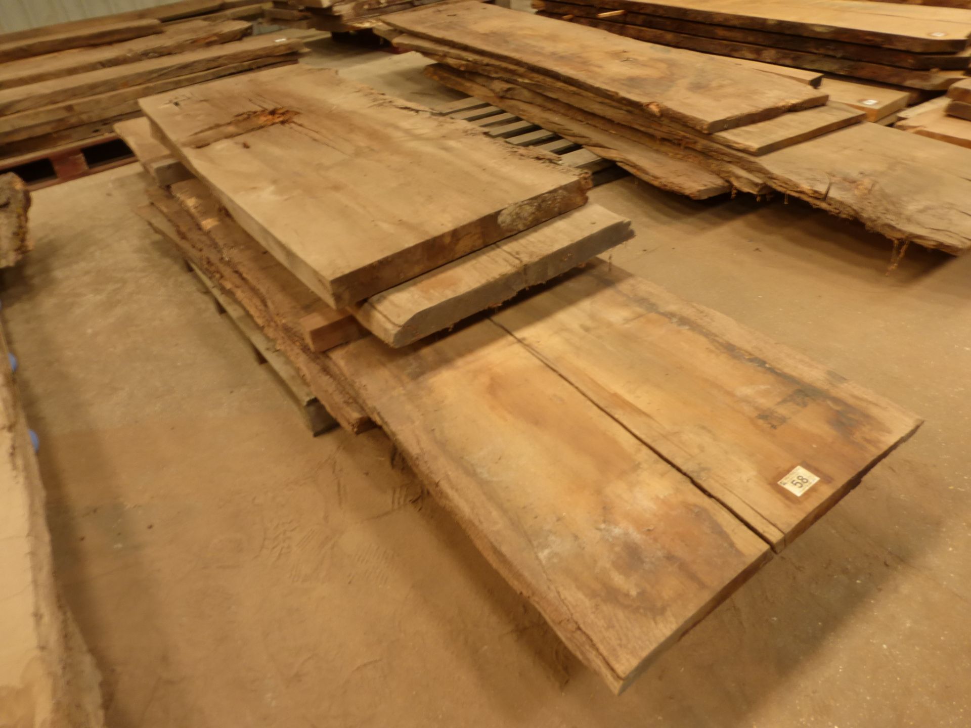 A pallet of 6 old oak planks; 2 x 1800 x 700 x 180mm and 1 x 3600 x 800 x 50mm and 1 x 3000 x 600