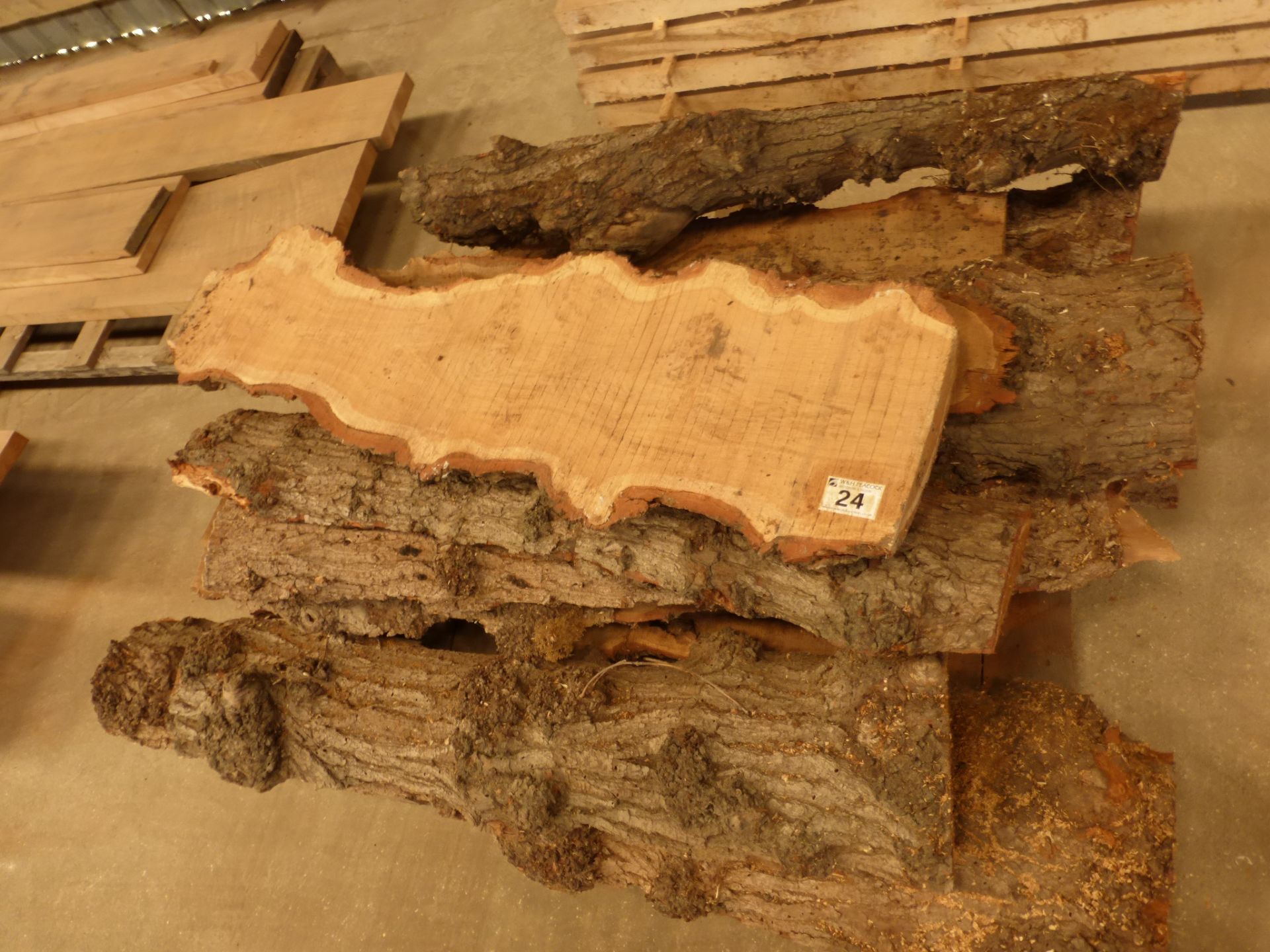 A pallet of approximately 13 planks of waney outer edge burr oak