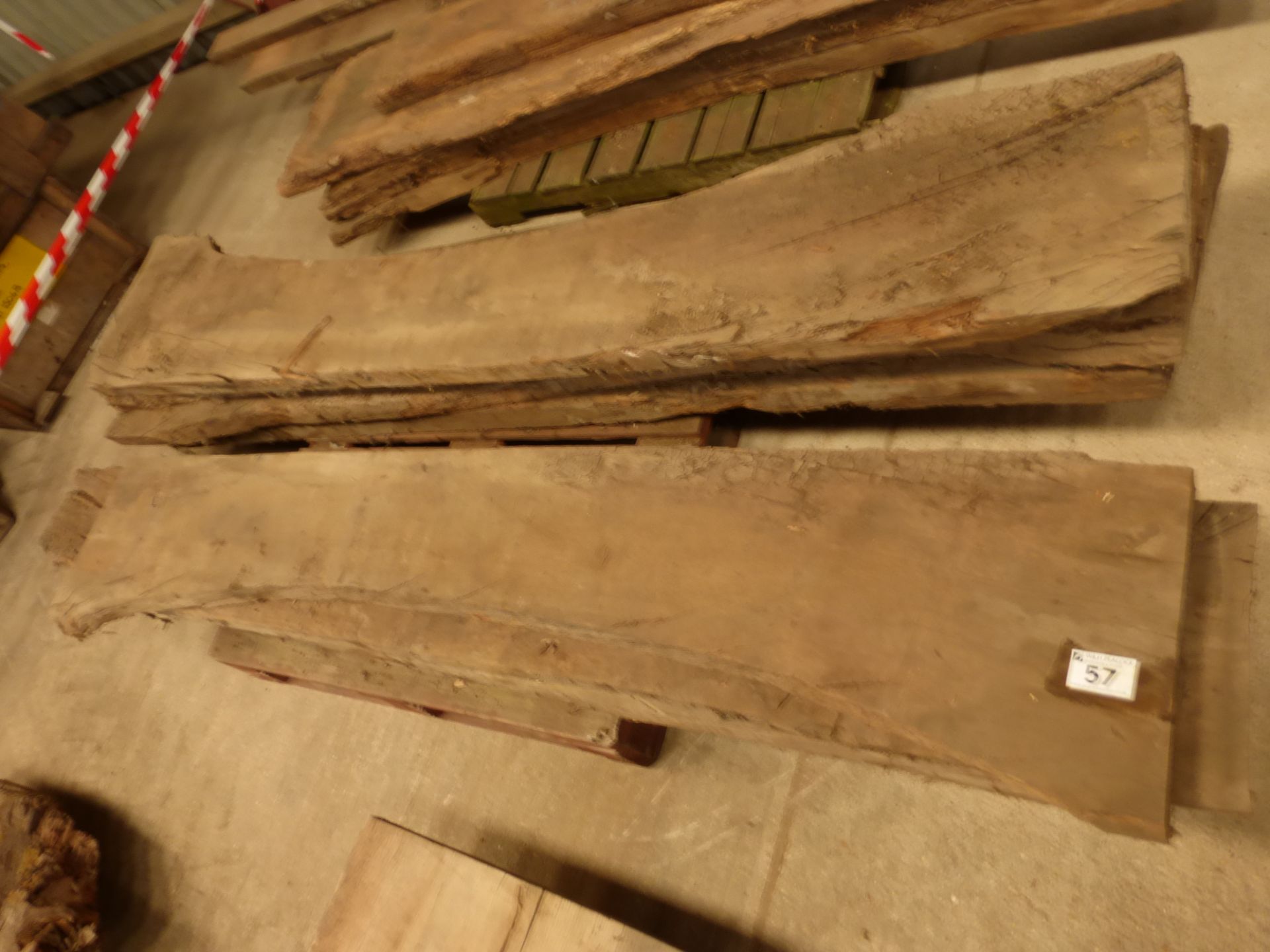 A pallet of 11 miscellaneous waney edge and rough sawn oak boards in various sizes, up to