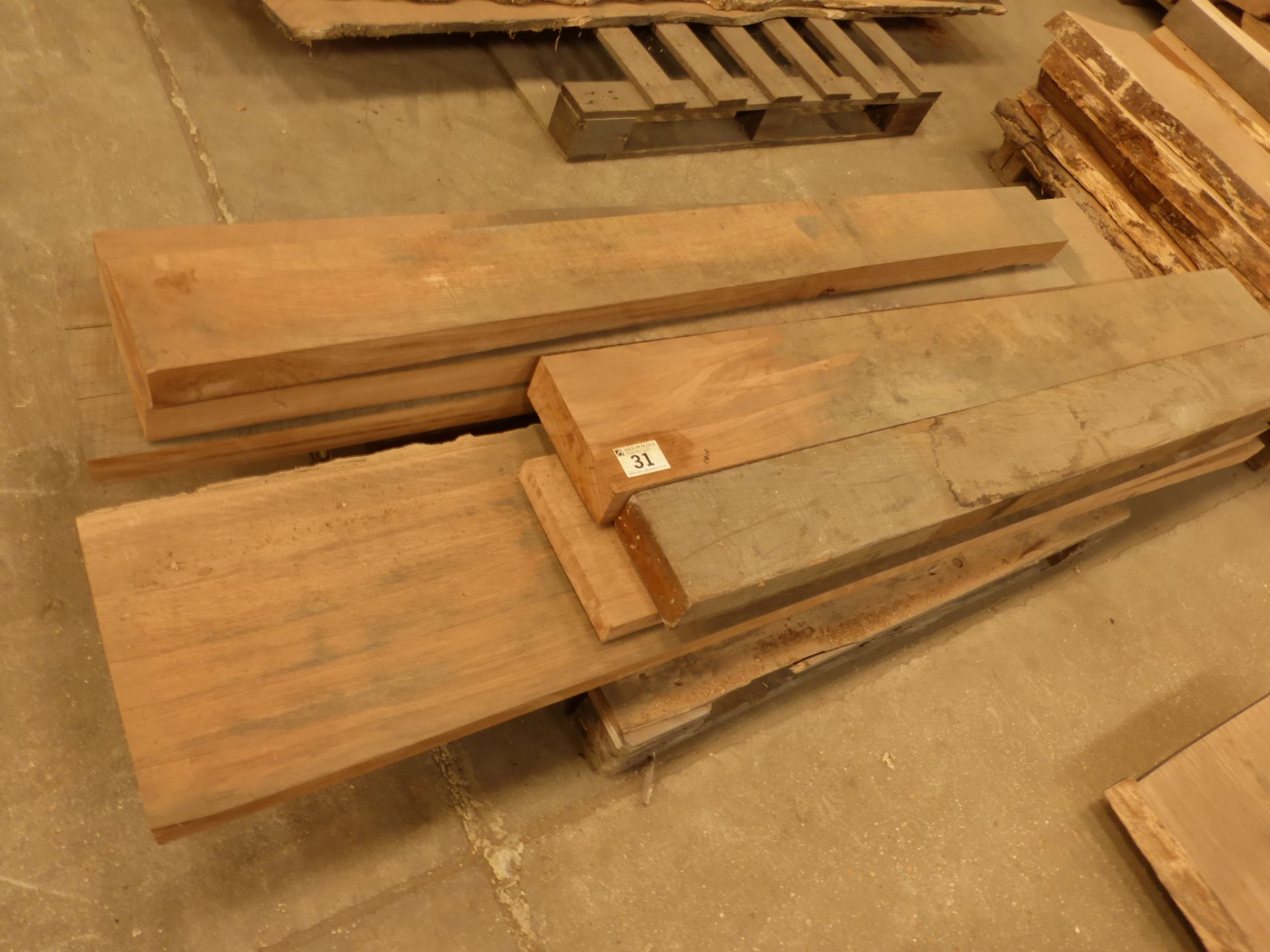 A pallet of 10 rough sawn oak planks in various sizes up to 2200 x 300 x 50mm
