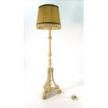 A French-style cream painted giltwood standard lamp on a tripartite base CONDITION