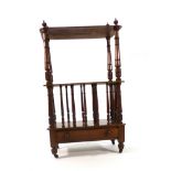 A Victorian mahogany what-not, the galleried surface over a Canterbury section and a single drawer,