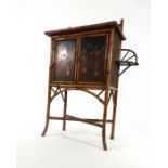 An Aesthetic Movement bamboo and chinoiserie panelled cabinet,