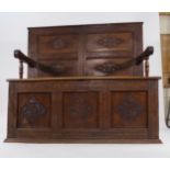 An 18th century and later oak panelled settle on a plinth base, w.
