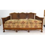 An early 20th century beech and double bergere three piece suite on claw feet CONDITION