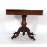 A 19th century rosewood folding card table on a baluster support and quadrupite base, w.