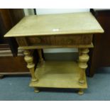 A Victorian oak side table, the single frieze drawer over a second tier on turned supports, w.