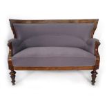 A 19th century continental stained beech and upholstered two seater sofa on turned legs