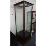 A mid-20th century mahogany and four glass display cabinet over a single door storage compartment,