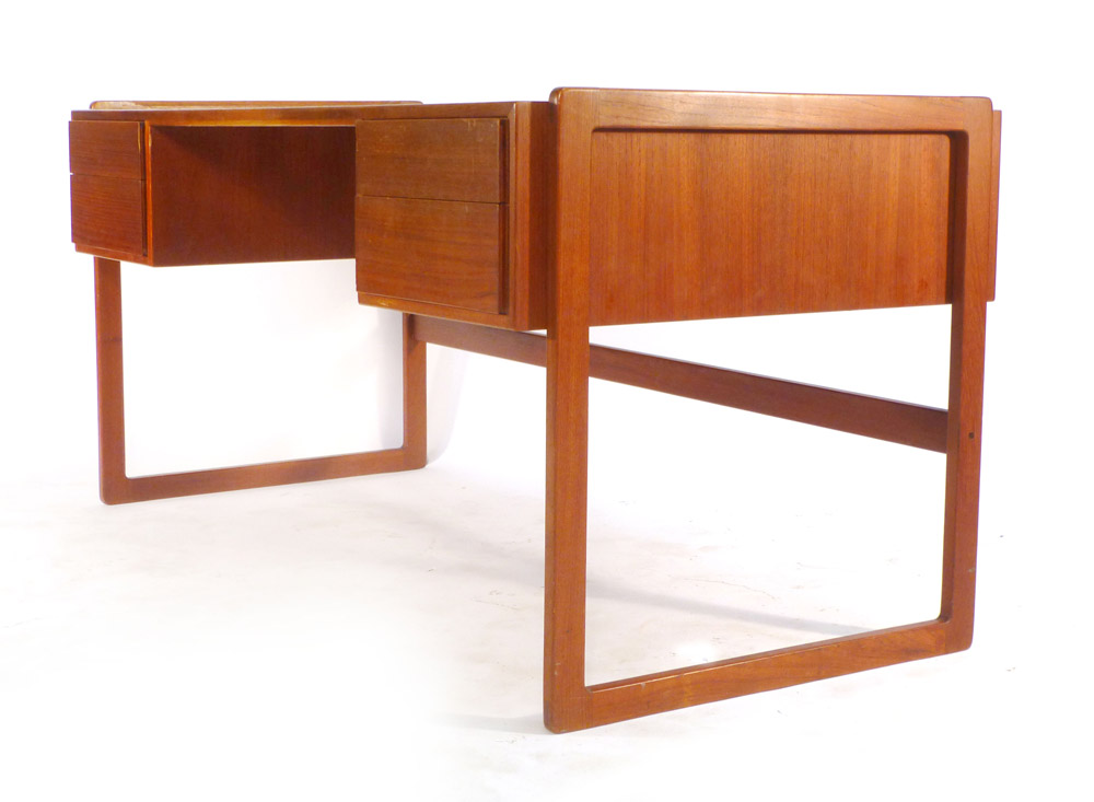 A 1970's teak desk with an arrangement on four drawer with a gallery section to the rear on square - Image 2 of 11