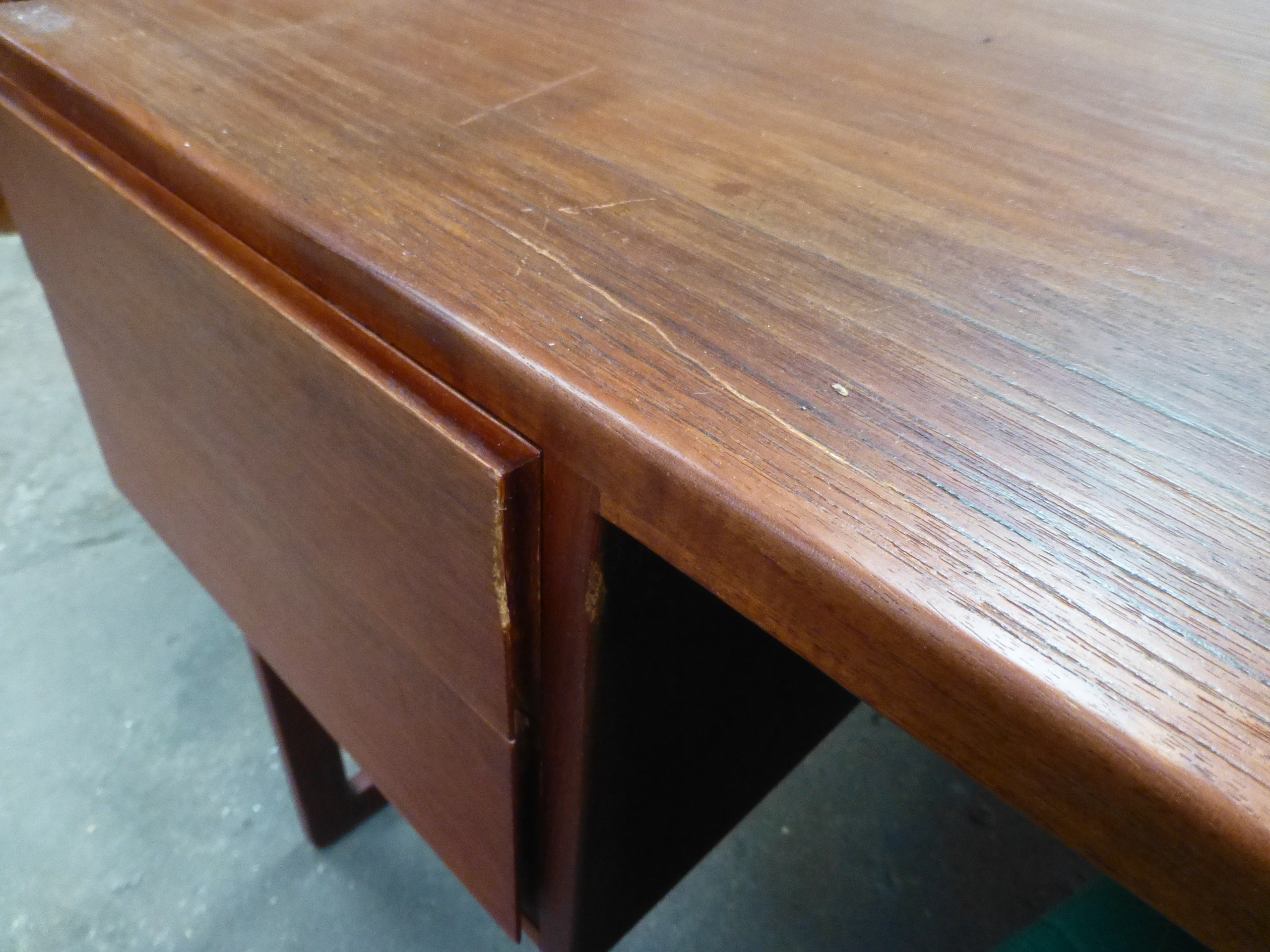 A 1970's teak desk with an arrangement on four drawer with a gallery section to the rear on square - Image 6 of 11