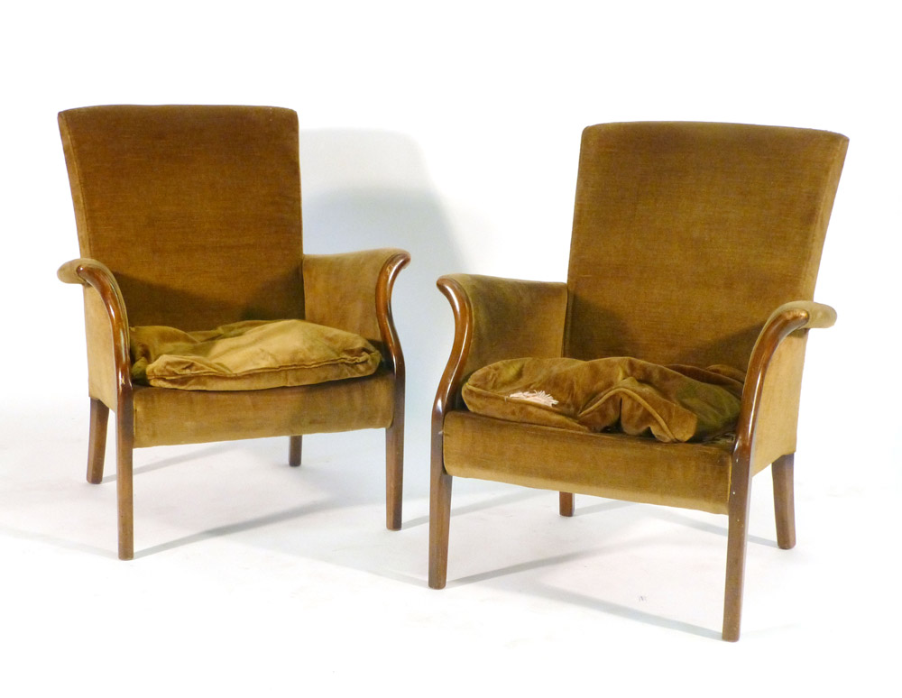 A pair of 1950/60's Parker Knoll upholstered armchairs with exposed beech frames