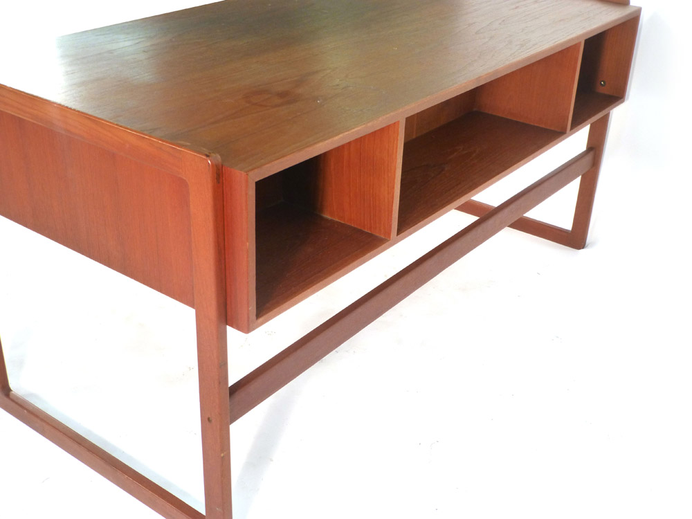 A 1970's teak desk with an arrangement on four drawer with a gallery section to the rear on square - Image 4 of 11