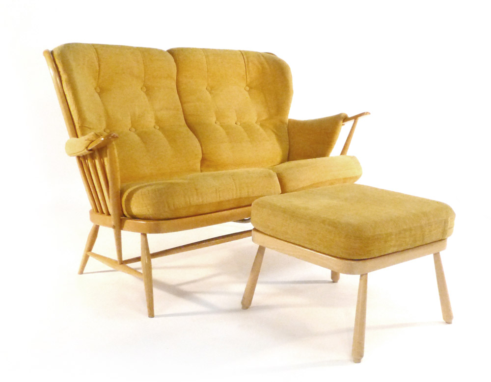 An Ercol beech and upholstered two seater sofa together with a matching footstool