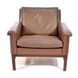 A 1970's brown leather armchair on an exposed mahogany frame CONDITION REPORT: wear