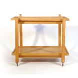 An oak two tier serving trolley on square straight legs and castors, l.