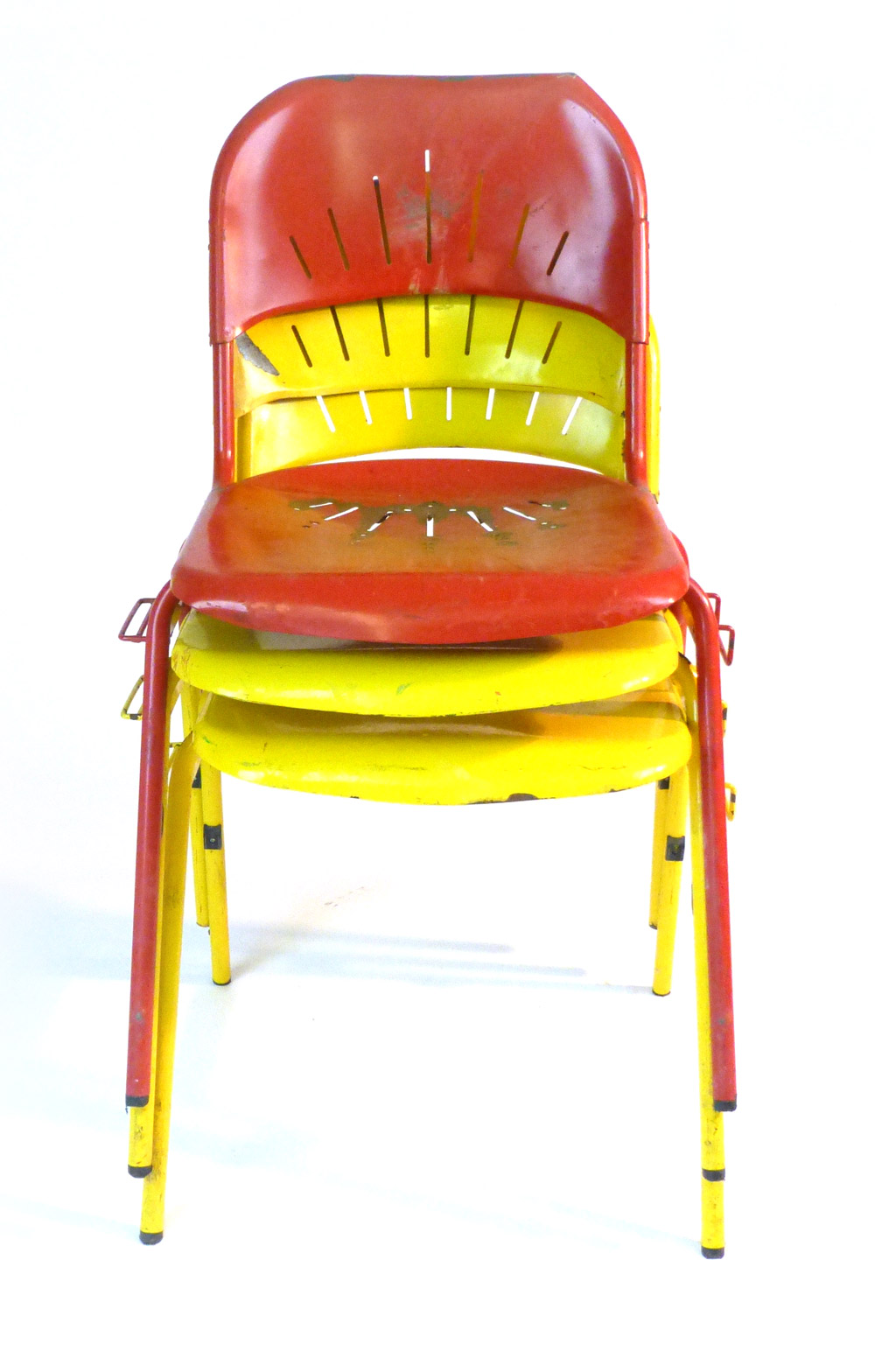 Three 1950/60's industrial red and yellow painted metal stacking and interlocking chairs