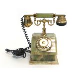 An Art Deco-type onyx and brass mounted dial telephone CONDITION REPORT: old