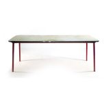 A 1950's French classroom/industrial table, on four red enamelled red tapering legs, l.