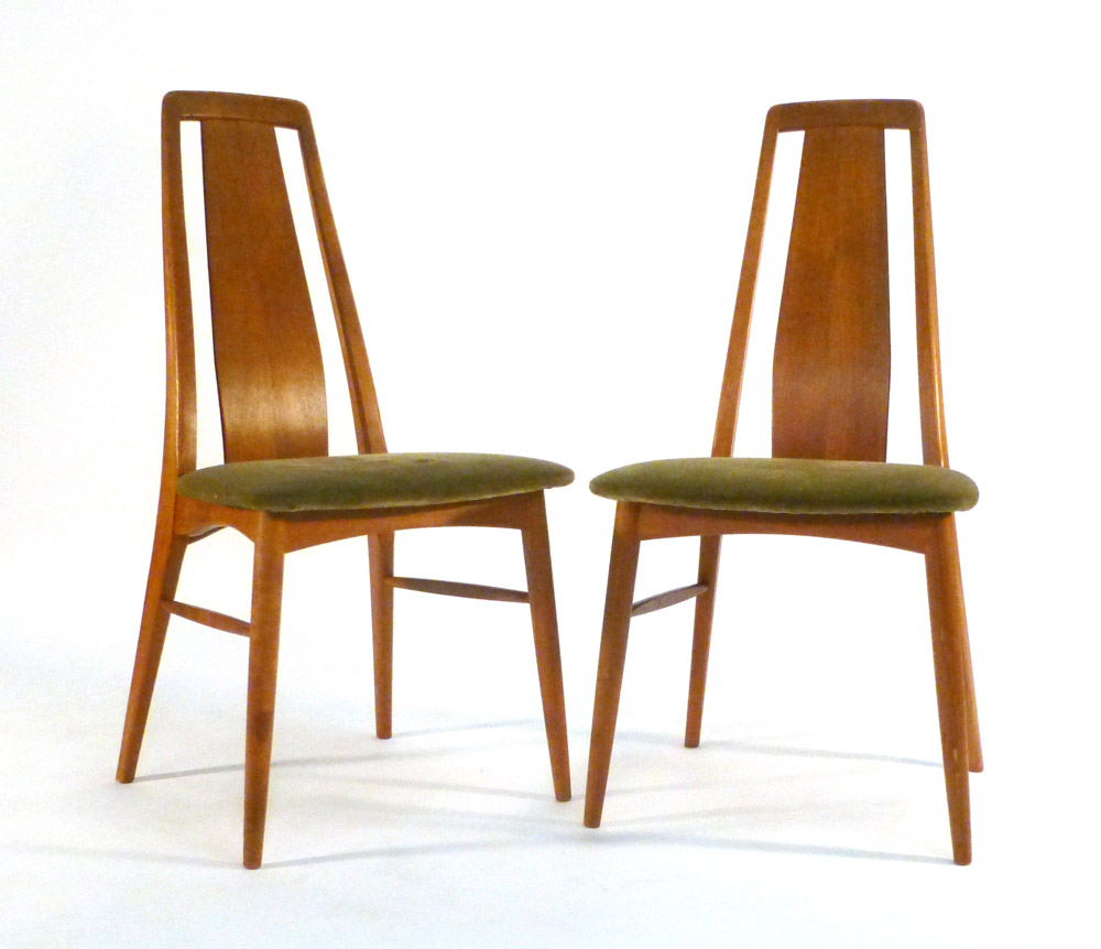 A pair of Danish teak highback dining chairs with upholstered seats and tapering legs by Koefoeds