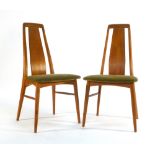 A pair of Danish teak highback dining chairs with upholstered seats and tapering legs by Koefoeds