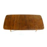 An Ercol elm and beech coffee table with tapering legs, l.