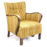 A 1940's stained beech and button upholstered loounge armchair on square straight legs