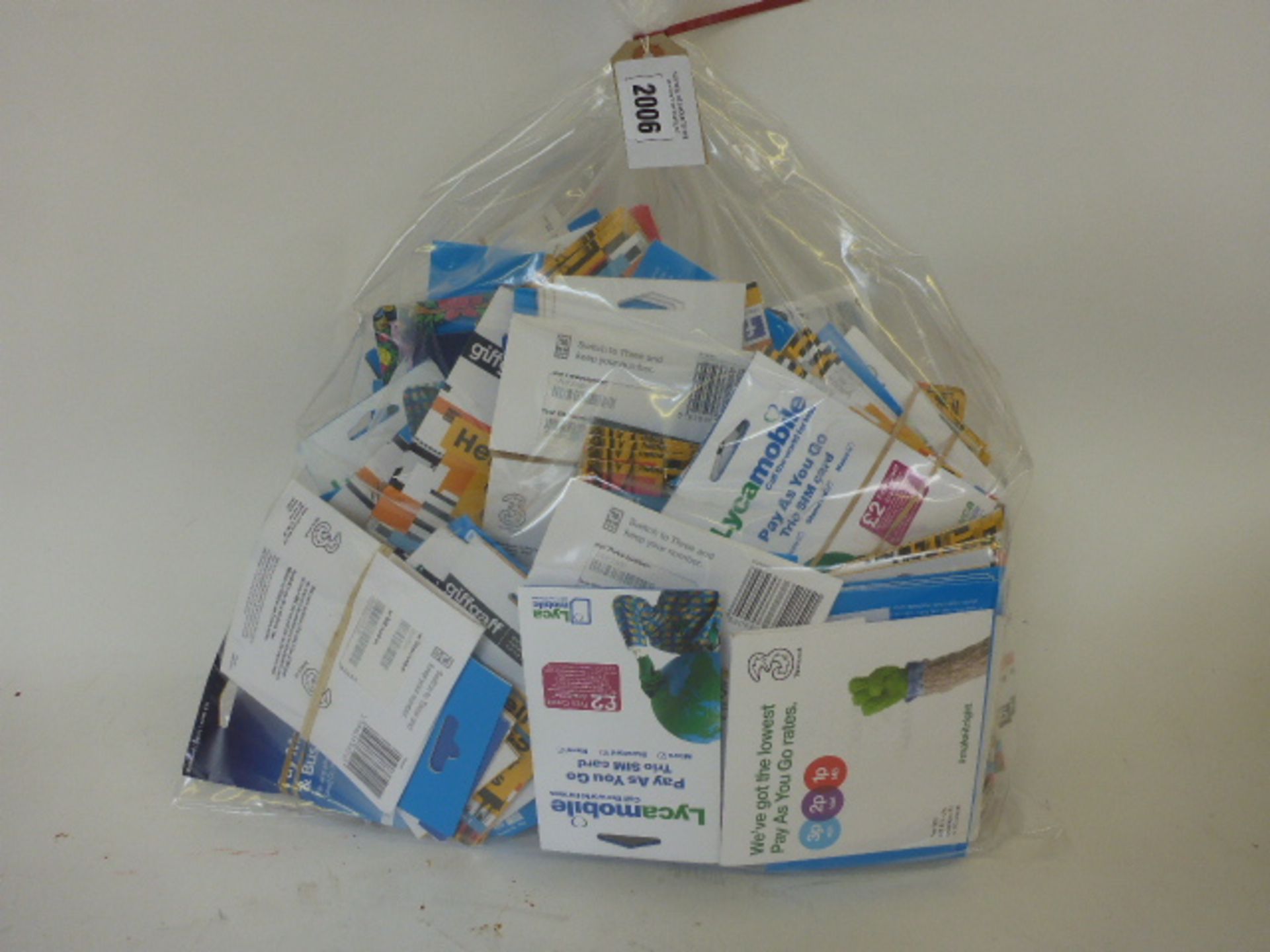 Bag containing large quantity of various sim cards, Lyca Mobile, GiffGaff, Three, O2 etc