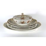 A Limoges part dinner service consisting four graduated meat dishes/serving dishes,