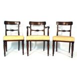 A set of eight Victorian mahogany and upholstered dining chairs on turned front legs,