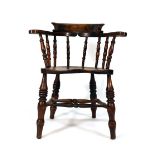 A late 19th century beech and elm seated captain's-type chair