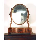 A late 19th century mahogany and inlaid swing mirror,