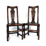 A pair of 17th century oak and ash hall chairs,