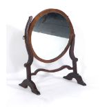 A 19th century walnut and mahogany circular swing mirror, h.