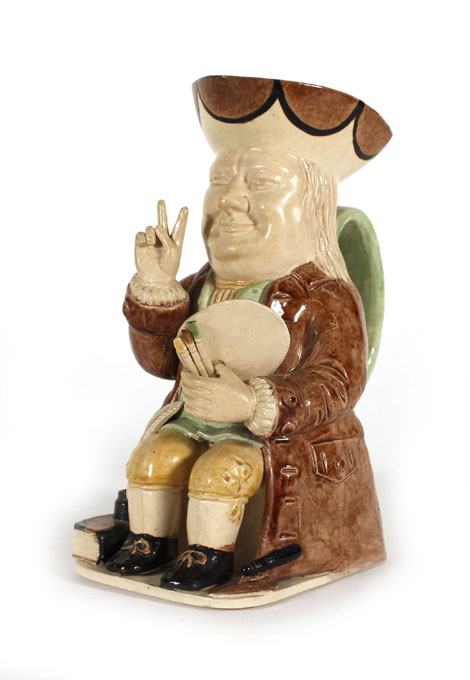 A Leonard Jarvis limited edition creamware toby jug modelled as a seated Winston Churchill,
