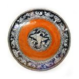 A New Hall 'Boumier Ware' lustre charger decorated in the Aesthetic manner on an orange ground, d.