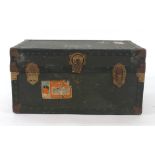 A 20th century brass bound trunk, bearing Cunard Line stickers, with a brass plaque inscribed 'P.M.