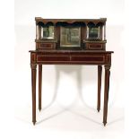 A 19th century rosewood, brass mounted and brass inlaid bonheur de jour,