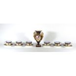 A set of six Royal Worcester tea cups and saucers, transfer printed and gilt decorated,